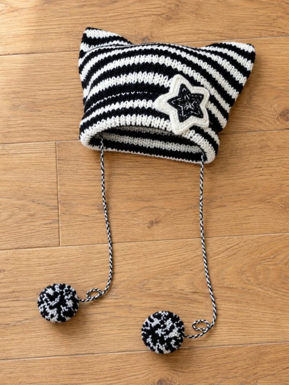 Black and white striped cat ear beanie with star patch and pom poms - y2k grunge